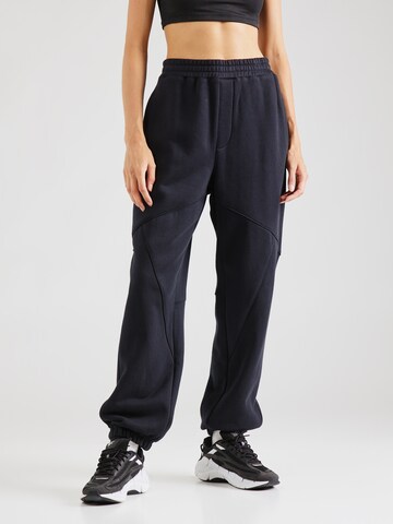 Reebok Tapered Trousers in Black: front