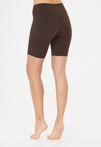 Athlecia Skinny Sportbroek 'Emarri' in Bruin