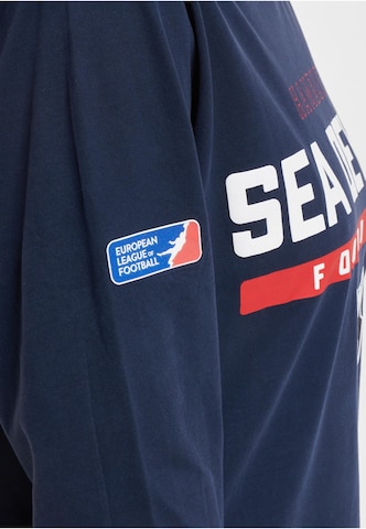 Maglietta 'DefShop x European League of Football Hamburg Sea Devils Identity' di DEF in blu