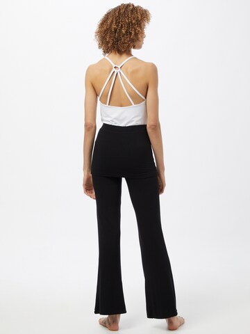 CURARE Yogawear - Tapered Pantalón deportivo en negro