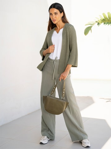 Wide leg Pantaloni con piega frontale di heine in verde