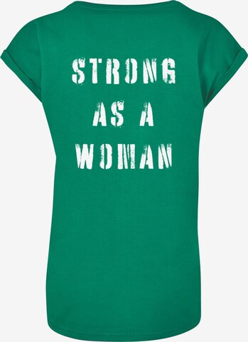 Merchcode Shirt 'WD - Strong As A Woman' in Grün