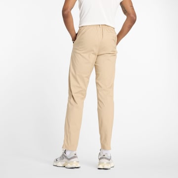 Regular Pantalon chino 'Athletics Standard Tapered' new balance en beige