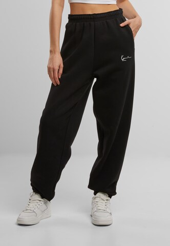 Karl Kani Loose fit Pants 'Essential' in Black: front