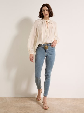 Skinny Jean Apricot en vert : devant