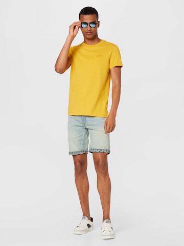 Superdry - Camiseta en amarillo