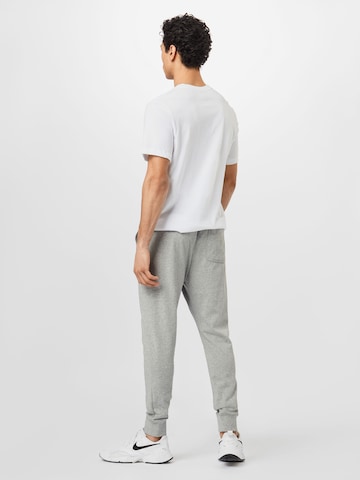 Tapered Pantaloni di Nike Sportswear in grigio