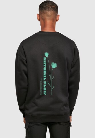 Sweat-shirt 'Natural Flow' Merchcode en noir : devant