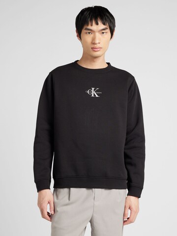 Sweat-shirt Calvin Klein Jeans en noir : devant