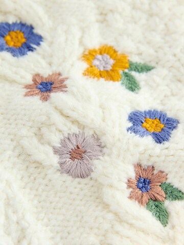 Next Neuletakki värissä beige