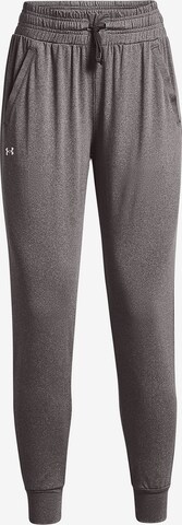 Effilé Pantalon de sport UNDER ARMOUR en gris : devant