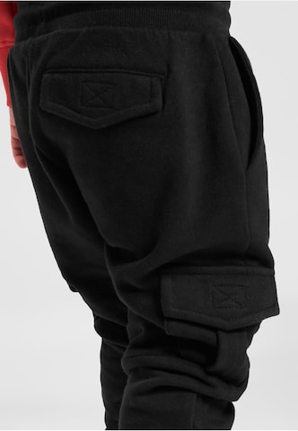 Tapered Pantaloni di Urban Classics in nero