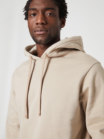 Sweat-shirt ABOUT YOU x Louis Darcis en beige