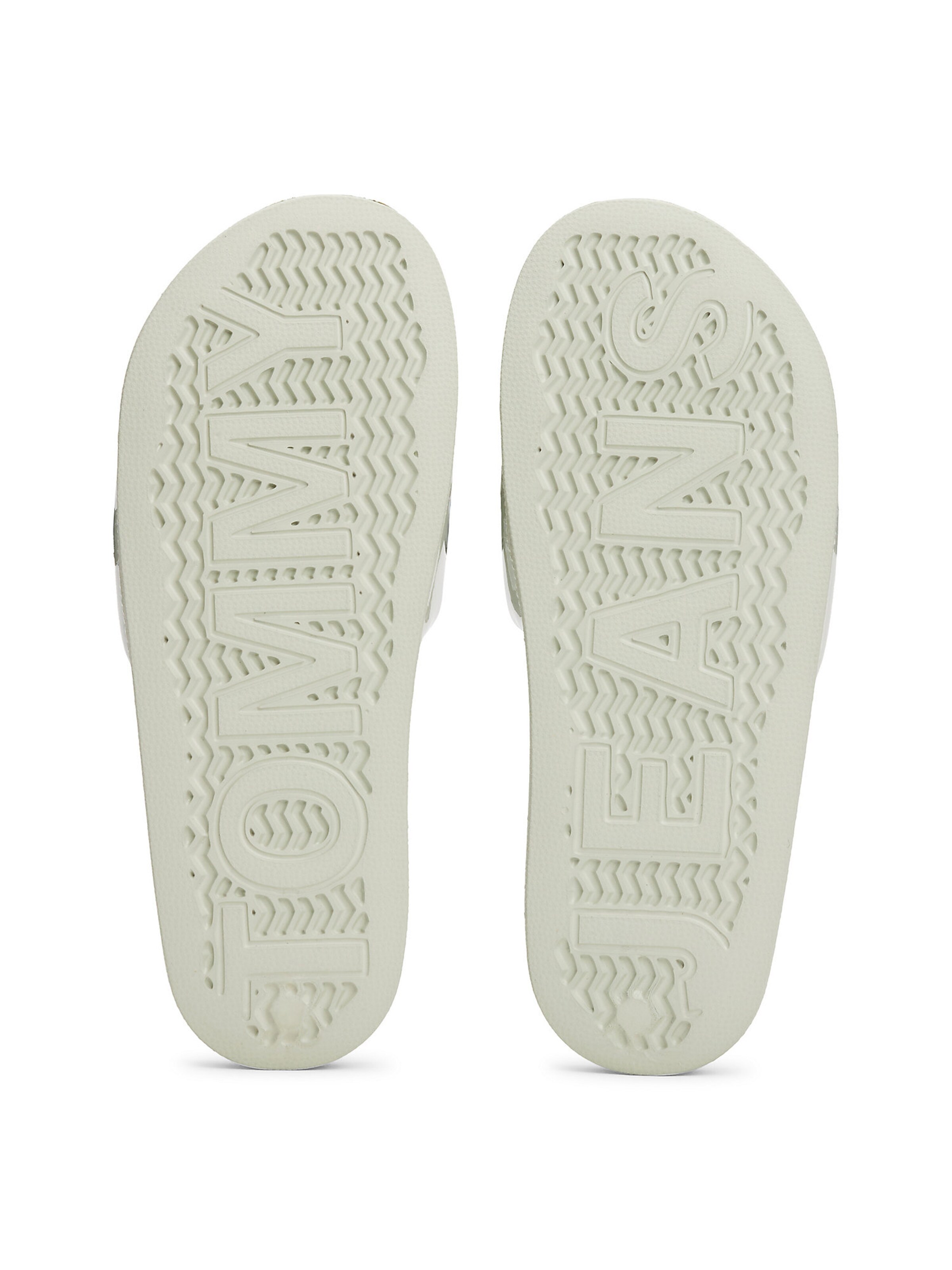 Claquettes / Tongs Tommy Jeans en blanc