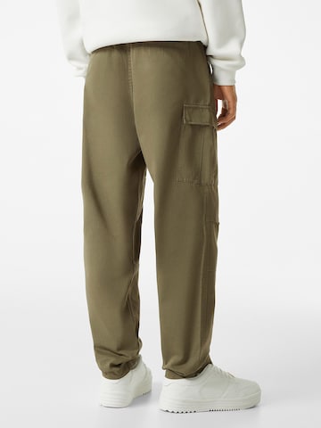 Bershka Loose fit Cargo trousers in Green