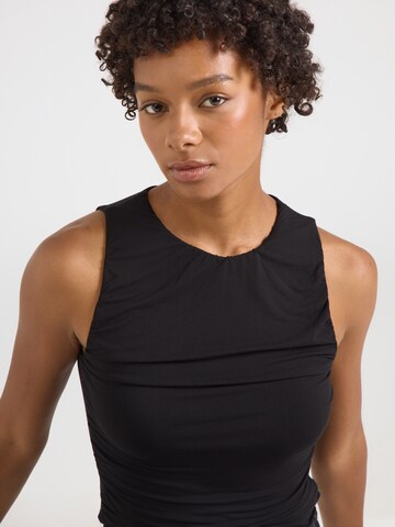 CURARE Yogawear Sporttop in Zwart