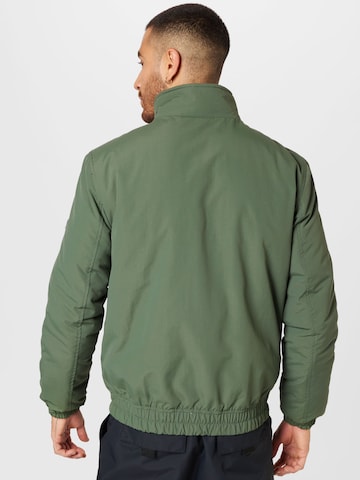 Tommy Jeans Φθινοπωρινό και ανοιξιάτικο μπουφάν 'Essential' σε πράσινο
