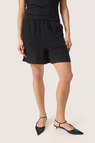 SOAKED IN LUXURY - Loosefit Calças 'Belira' em preto: frente