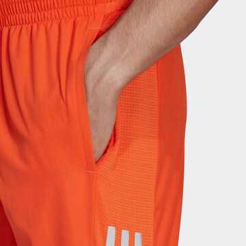 Regular Pantalon de sport 'Own the Run' ADIDAS SPORTSWEAR en orange