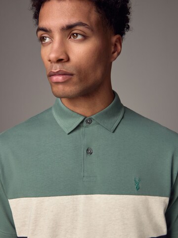 Next Poloshirt in Grün