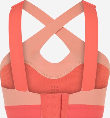 Reebok Bustier Urheilurintaliivit värissä oranssi