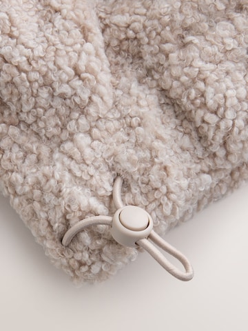 Pull-over self. en beige