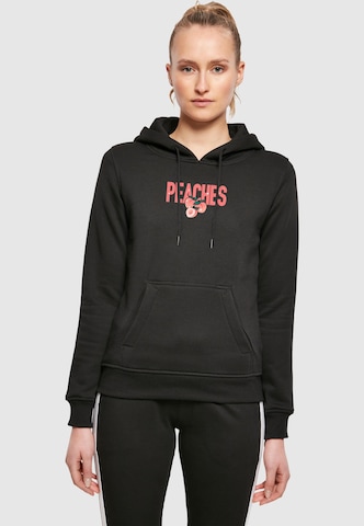 Sweat-shirt 'Peaches' Mister Tee en noir : devant