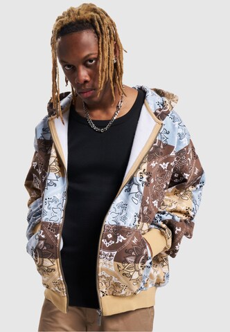 Veste de survêtement Karl Kani en beige : devant