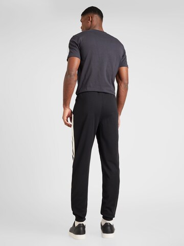 Sergio Tacchini Tapered Sporthose 'NEW DAMARINDO' in Schwarz
