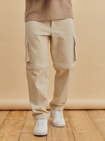 DAN FOX APPAREL Tapered Gargohousut 'Hasan' värissä beige: edessä