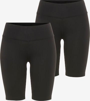 FAYN SPORTS Skinny Workout Pants in Black: front