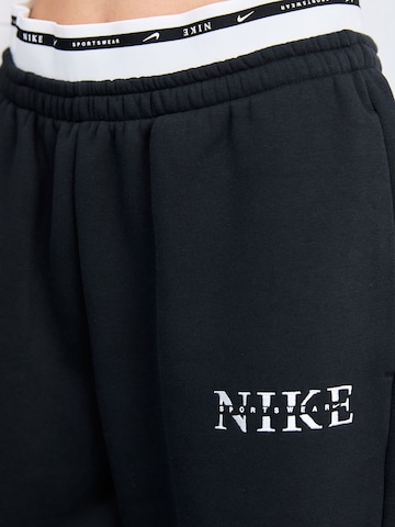Nike Sportswear - Loosefit Pantalón 'PHNX FLC' en negro