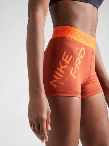 NIKE Skinny Športne hlače | oranžna barva