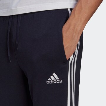 ADIDAS SPORTSWEAR Tapered Workout Pants 'Essentials Fleece Tapered Cuff 3-Stripes' in Blue