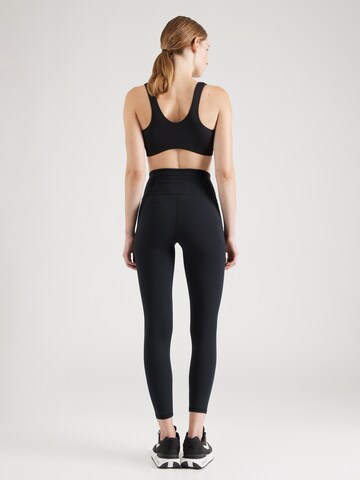 UNDER ARMOUR Skinny Legíny 'Motion' – černá