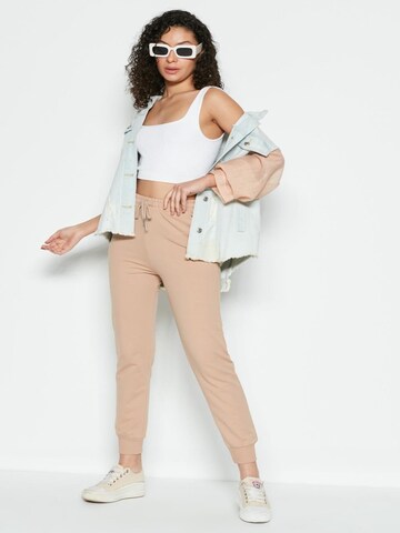 C&City Tapered Pants in Beige: front