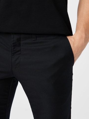 Carhartt WIP Slimfit Jeans 'Sid' i svart