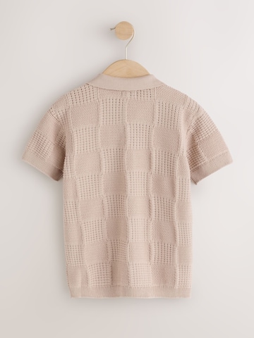 Next Neuletakki värissä beige