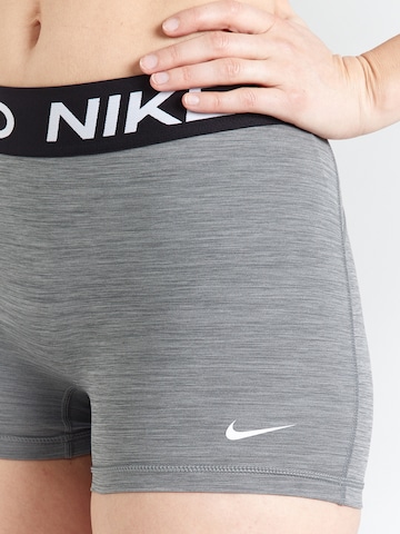 NIKE Skinny Športne hlače 'Pro 365' | siva barva