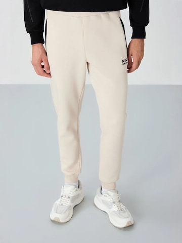 Pantaloni sportivi di Tommy Life in beige: frontale
