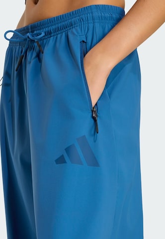 ADIDAS SPORTSWEAR - Pierna ancha Pantalón deportivo 'Z.N.E.' en azul