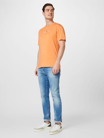 Tommy Jeans قميص بلون برتقالي