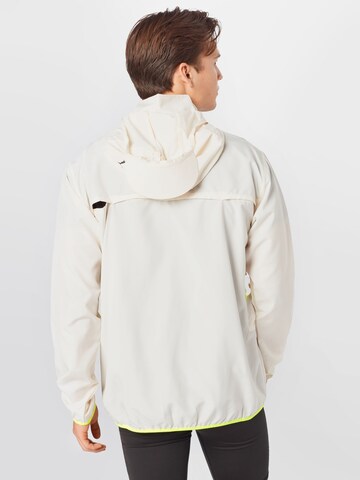 Veste de sport 'First Mile' PUMA en beige