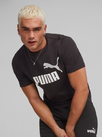 PUMA Funkčné tričko 'Essentials' - Čierna: predná strana