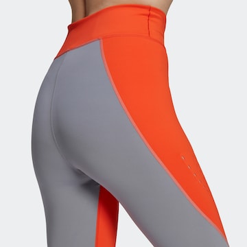 Skinny Pantaloni sport 'True Purpose' de la ADIDAS BY STELLA MCCARTNEY pe portocaliu