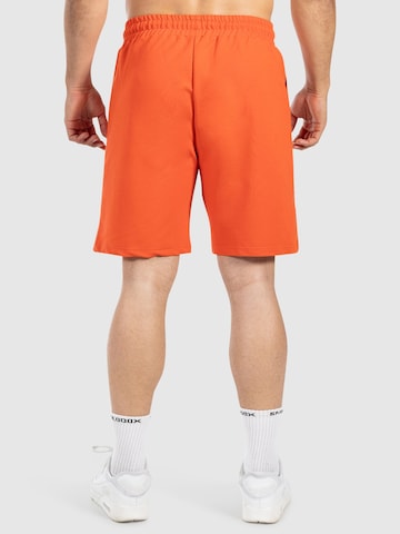 Loosefit Pantalon de sport ' Edin ' Smilodox en orange