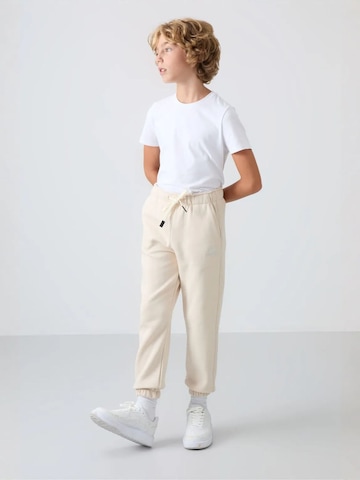 Tommy Life Broek 'TOMMY Kinder Jogginghose' in Beige