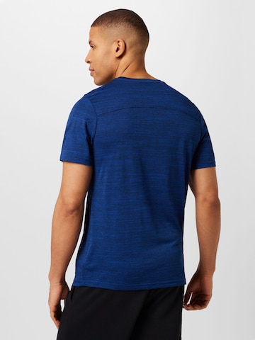 SKECHERS - Camiseta funcional en azul