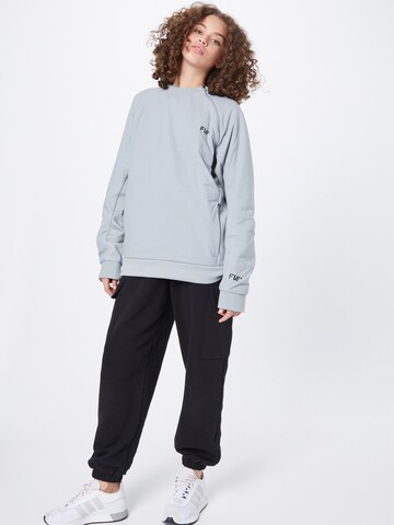 FW Sweatshirt 'MANIFEST' i grå