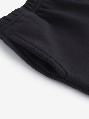 Wide leg Pantaloni di Next in nero